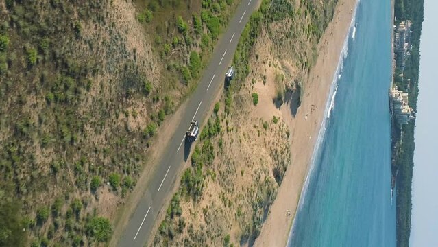 vertical video of drone car chase near alepu beach Bulgaria