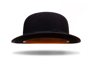 Black bowler hat floating with shadow isolated