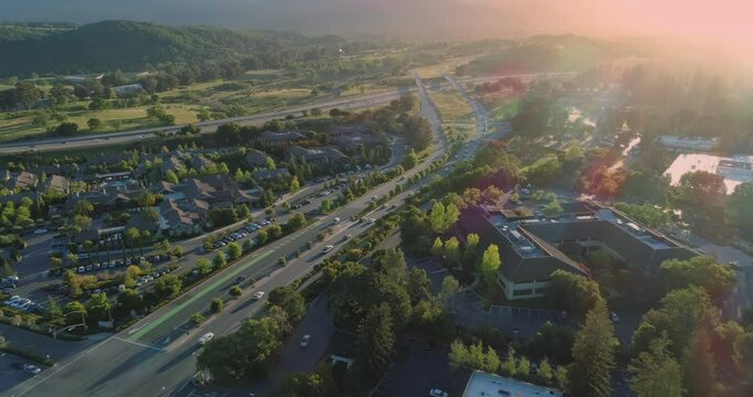 Aerial: Flying over Sandhill Road and the 280 Freeway, home of venture capital firms. Menlo Park, Silicon Valley. 