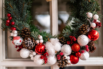 beautiful Christmas wreath on a white door. holidays.