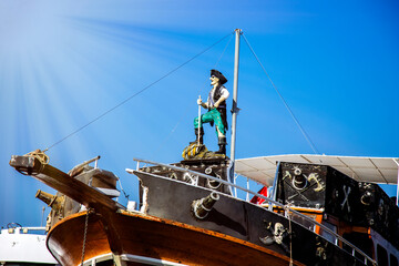 ship in the sea and pirate on it blue sky in sunny day 