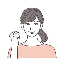 笑顔でガッツポーズをする女性 ピンク