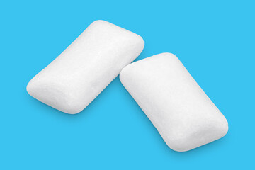 Three pieces of white chewing gum isolated on white. The whole subject is in focus.