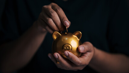 Business hand protecting and saving gold piggy bank, Stock funding or money saving. financial...