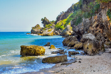 The beauty of white sand beach with beautiful scenery and rocks around it.