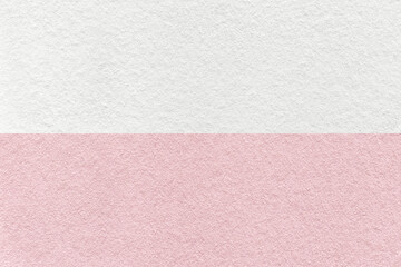Texture of craft pastel white and pink paper background, half two colors, macro. Structure of...