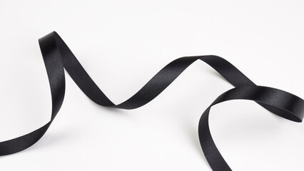 Abstract shape black ribbon isolated on white background.