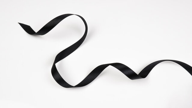 Abstract shape black ribbon isolated on white background.