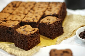Taiwanese Castella cake. homemade chocolate cake so soft and delicious with ingredient: eggs, cocoa, milk, flour and choco chips sprinkles. bakery concept for background or wallpaper. close up.