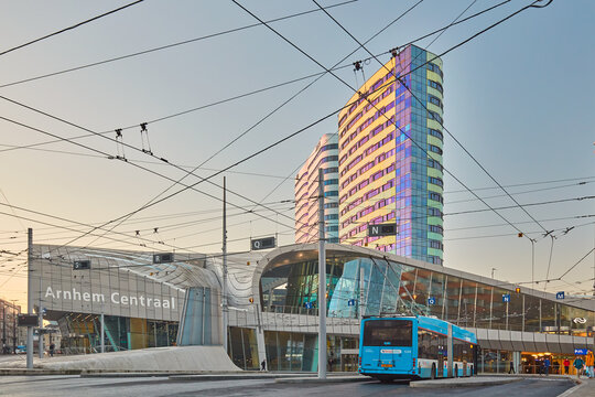 View at the central railway station area  during rush hour with buses and commuters in Arnhem, The Netherlands on December 12, 2022