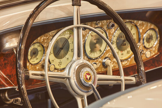 Interior of a classic Mercedes Benz car with wooden dashboard in Essen, Germany on March 23, 2022