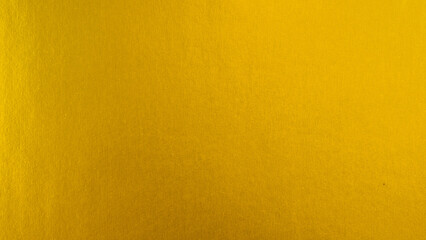 Gradation gold foil leaf shiny with sparkle yellow metallic texture background.
Abstract paper glitter golden matt glossy for template.
top view.