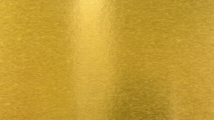 Abstract paper golden for Merry Christmas and Happy new year.
Gradation gold foil leaf shiny with sparkle yellow metallic texture background.
top view.