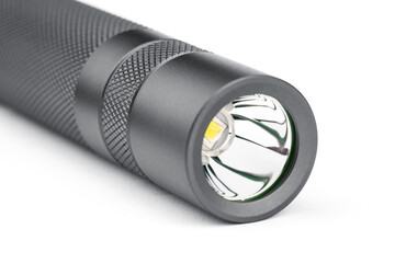 Modern aluminum LED Pocket Flashlight isolated on white background. 