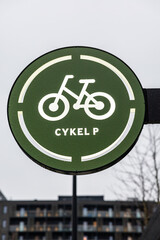 Copenhagen, Denmark, A sign for a bicycle parking facility.