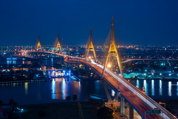 View of Bhumibol Bridge across the Chao Phraya River at night is a landmark of Bangkok, Thailand
