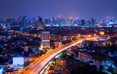Fototapeta na wymiar Freeway street at night, road through the city at the capital city of Bangkok, Thailand
