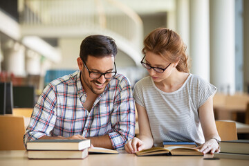 Education friendship people concept. Group of happy students learning together in college library