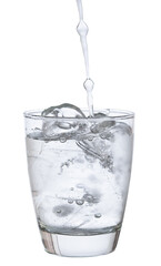 pour water in glass with ice  isolated on white background clipping path