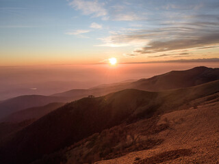 Golden Sunset over the soft hills of mount Bollettone, Italy