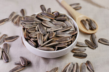 sun flower seeds in a bowl on table 