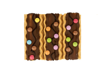 crispy biscuits with caramel and decorated with lentils