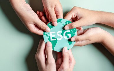 Hands together holding ESG Environmental, environmental, social, and governance in sustainable and ethical business on the Network connection.