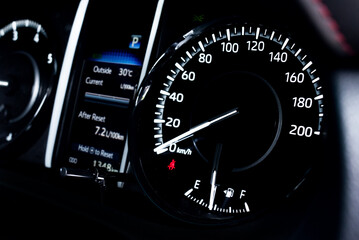 light with car mileage with black background,number of speed,Odometer of car.