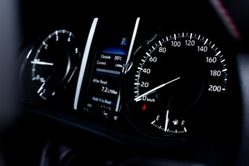 light with car mileage with black background,number of speed,Odometer of car.