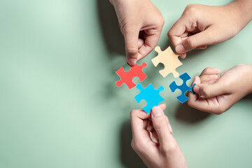 Color puzzle symbol of awareness for autism spectrum disorder family support. Father, Mother, Children holding jigsaw puzzle Autism World Awareness Day. - obrazy, fototapety, plakaty