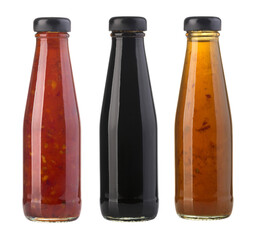 the various barbecue sauces in glass bottles