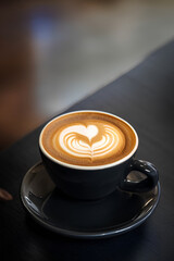 Cup of coffee on black background