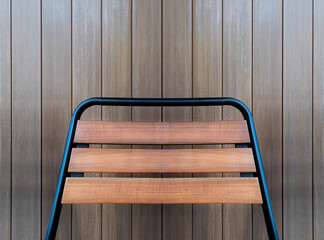 Chair back with brown wood line pattern background