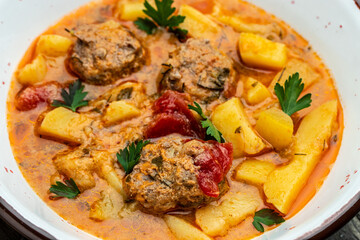 stew lecho with meat on a light background, Restaurant menu, dieting, cookbook recipe top view