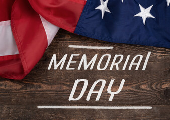 Fototapeta na wymiar Memorial Day Text, Honoring All Who Served with American Flag over White Wood Background