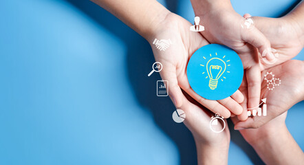 Hands holding light bulb with business target planning development leadership and customer target...