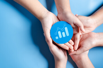 Hands holding chart growth with business target planning development leadership and customer target group, investment growth and success development, achievement, goal, strategy, finance concept.