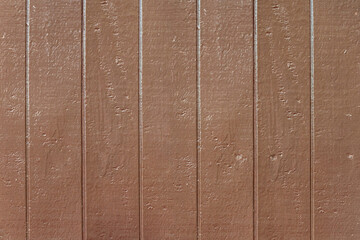Dark brown wooden background  Rough, shiny surface from the paint on the wood.  abstract background.