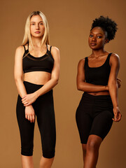 Two girls posing in studio. Diversity concept. Beauty photography.