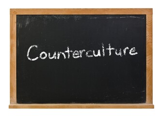 Obraz premium Counterculture written in white chalk on a black chalkboard isolated on white