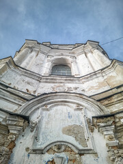 Old shabby bell tower of the Ukrainian Orthodox Monastery. Ascension Monastery Pereyaslav, Ukraine. Down-up view.