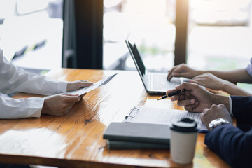 The employer or committee is interviewing and discussing the job applicant's resume. The manager is interviewing a new employee for a job. Job Search and Human Resources