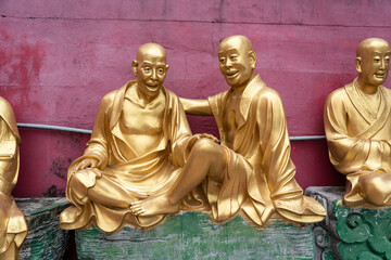 Fototapeta na wymiar Three Buddhas at The Ten Thousand Buddhas Monastery at Sha Tin in Hong Kong