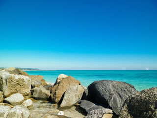 Stones on beach in Vada, Italy.