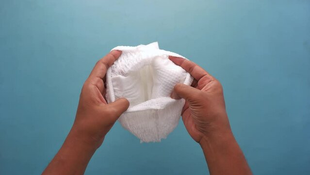  top view of holding a baby diaper 