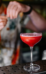 man hand bartender making sweet and sour refreshing cocktail on the bar counter