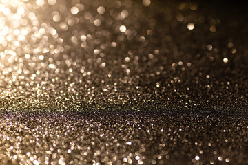 Black glittering background for design and free space.