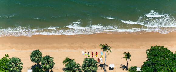 Above view of Pattaya beach in the summer season. High angle shot aerial of beautiful tropical sea with soft waves. © bigy9950