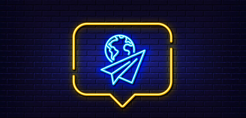 Neon light speech bubble. Paper plane line icon. International flight sign. Online travel symbol. Neon light background. Paper plane glow line. Brick wall banner. Vector