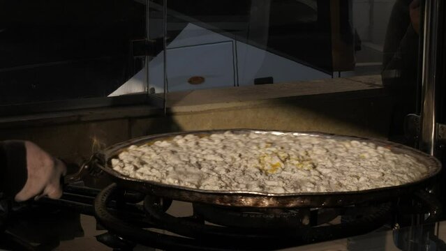 Preparation of Knafeh (or Kunafa), a traditional Middle Eastern dessert 